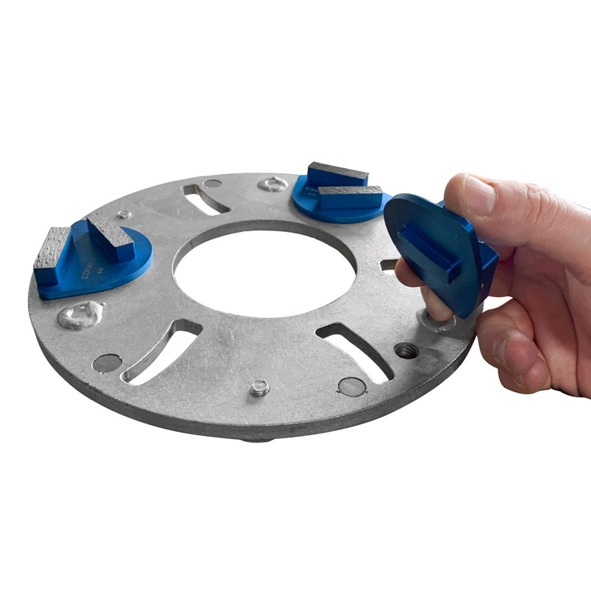 A concrete ride-on power trowel can be converted to house grinding and polishing planetary discs which can be used to grind down surfaces. Available from Speedcrete, United Kingdom.