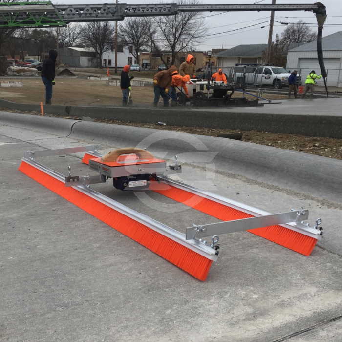 The Chameleon Trac 11 Brush Kit is fed across the concrete via a rope which is pulled by a motor. This applies a brushed finish to concrete across wide bays or areas where poles can not be connected. The Chameleon Trac 11 Brush Kit is fed across the concrete via a rope which is pulled by a motor. This applies a brushed finish to concrete across wide bays or areas where poles can not be connected.