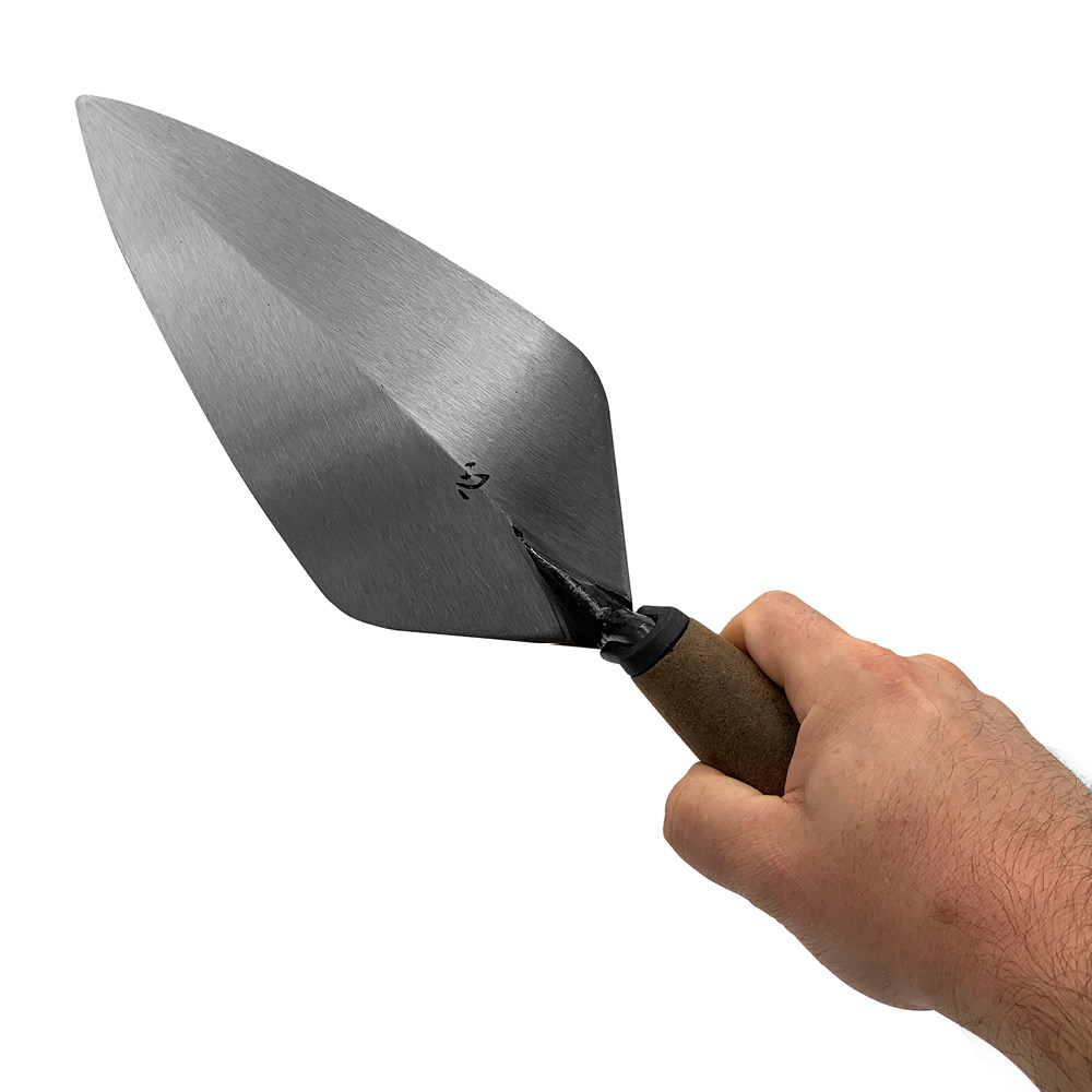 Leather handle kokoro bricklayers trowel in a narrow London style made from a single piece of forged steel. Available from Speedcrete, United Kingdom.