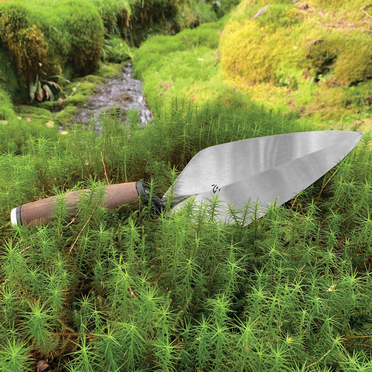 Leather handle kokoro bricklayers trowel in a narrow London style made from a single piece of forged steel. Available from Speedcrete, United Kingdom.