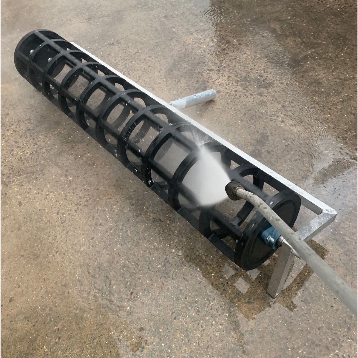 Concrete pattern roller from Speedcrete creates squares in the concrete for yards and agricultural shed floors.