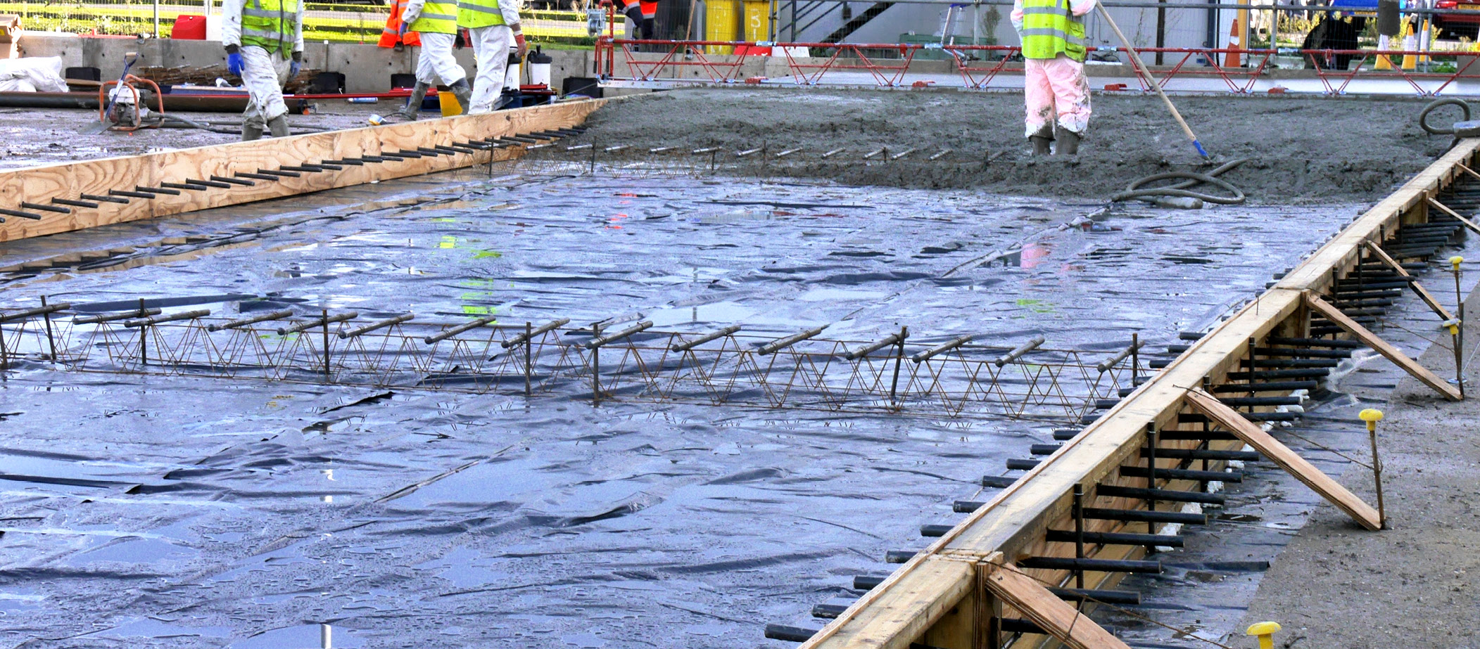 Dowel bars in concrete slabs are short, smooth steel rods placed at joints to transfer loads and allow for expansion and contraction due to temperature changes. They connect adjacent concrete slabs without restricting horizontal movement.